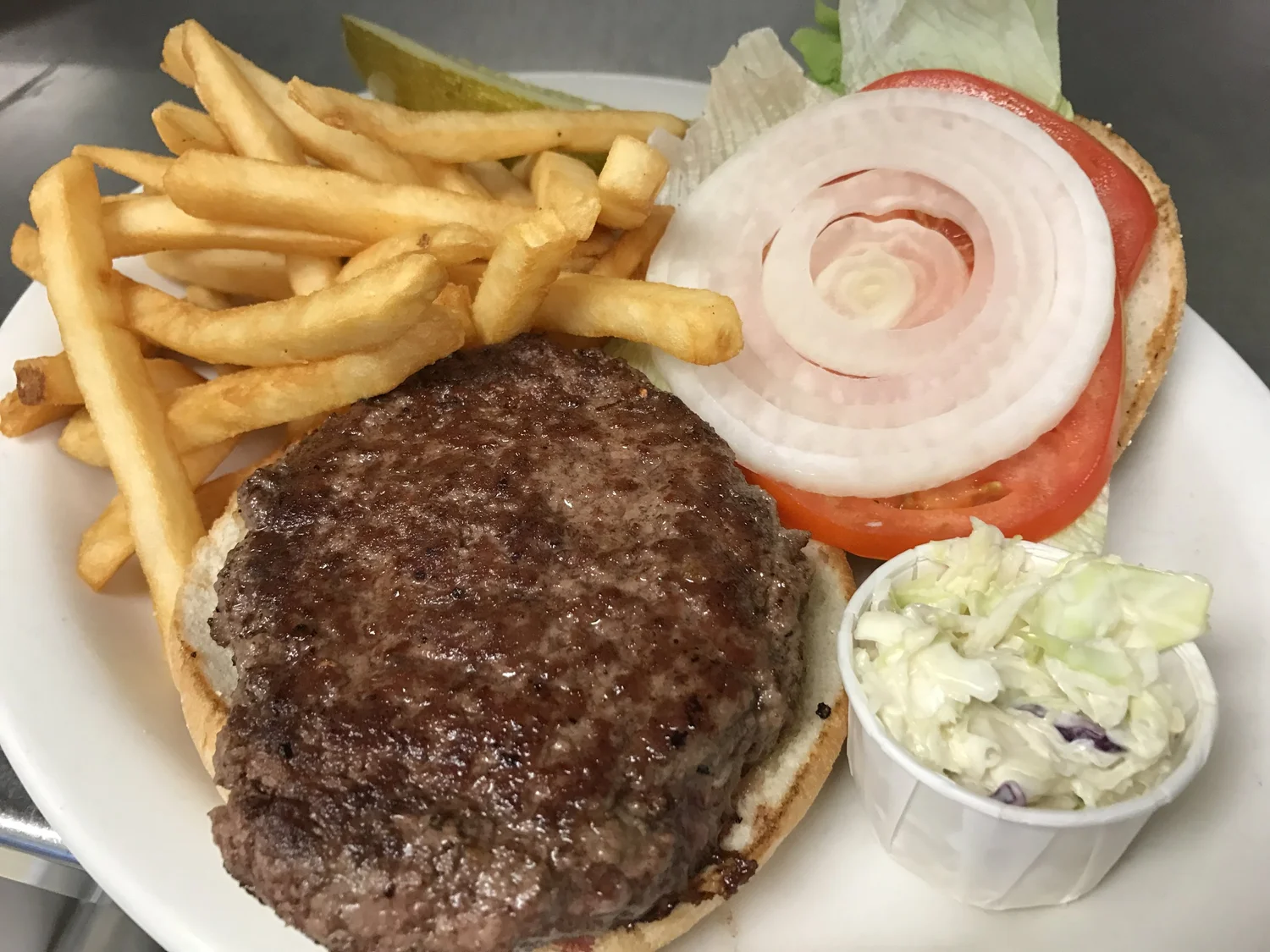 Black Angus cheeseburger deluxe with lettuce and tomato