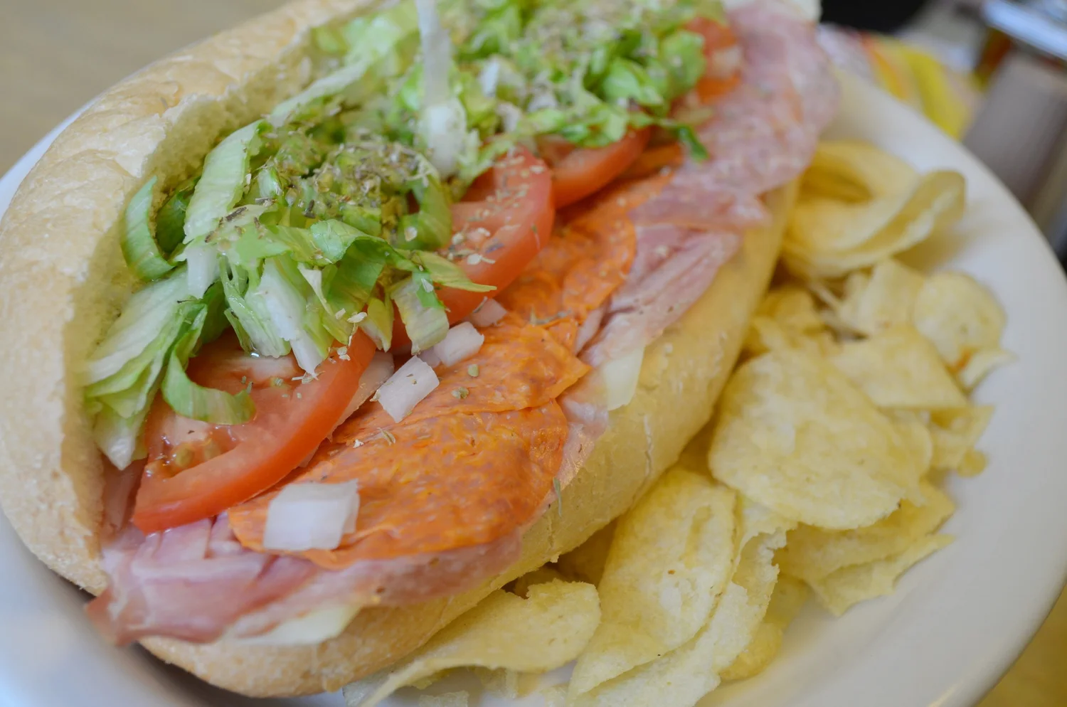 Real Italian hoagie with prosciutto, salami and provolone on a long roll