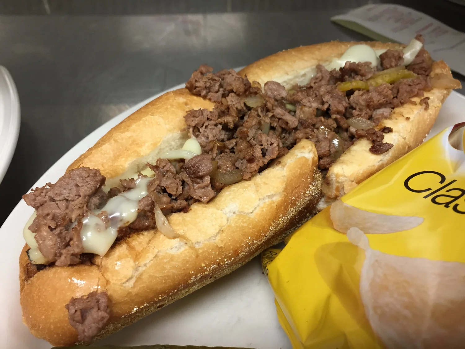 Philly cheesesteak on an Amoroso roll with melted American cheese